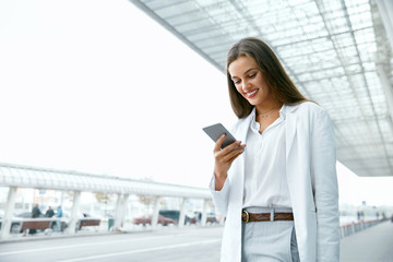 Business Woman With Phone On Street.