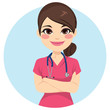 Beautiful young professional nurse woman portrait wearing pink uniform