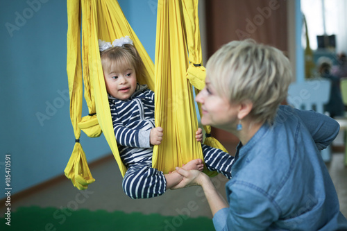 Fotografie, Obraz Doing yoga is mom and child Toddler Down syndrome