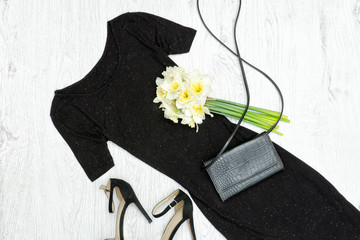 Wall Mural - Black dress, shoes, clutch and a bouquet of daffodils. Fashionable concept.