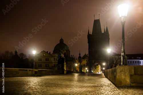Cuadros en Lienzo Charles bridge in Prague with lanterns at night