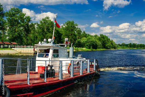 Fotografie, Obraz The river tug of red color that that transports on the river