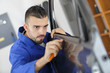 Mechanic fitting car door rubber trim
