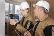© auremar - construction workers drilling a wall