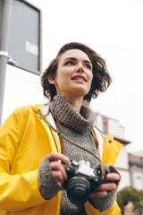 Wall Mural - Concentrated young lady photographer