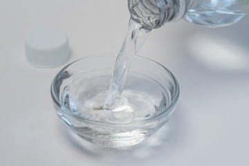 Wall Mural - Pouring White Vinegar into an Ingredient Bowl