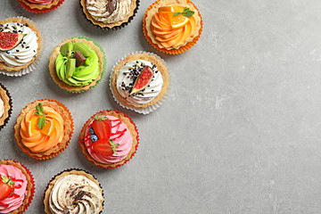 Poster - Tasty colorful cakes on grey background