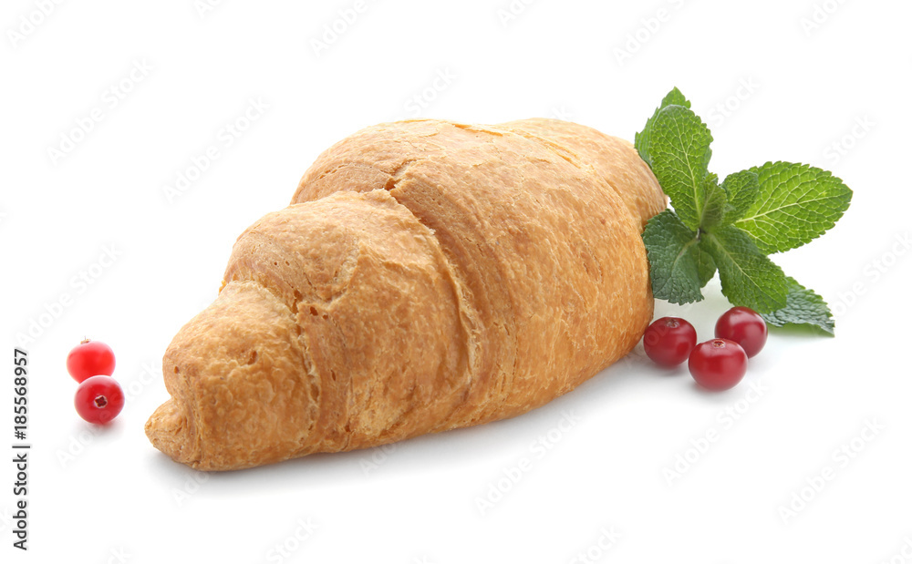 Yummy fresh croissant with cranberry on white background