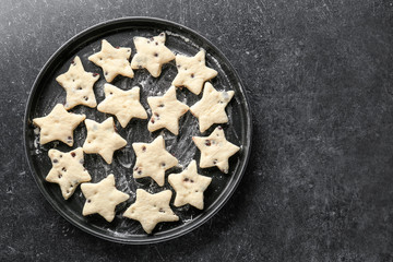 Canvas Print - Plate with raw cookies on dark background