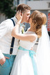 © johnalexandr - the bride and groom kissing near the registry office