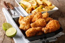 Delicious Food: Deep-fried Chicken Wings In Breadcrumbs And Potato Close-up. Horizontal