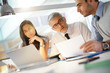 © goodluz - Business team working together on financial project