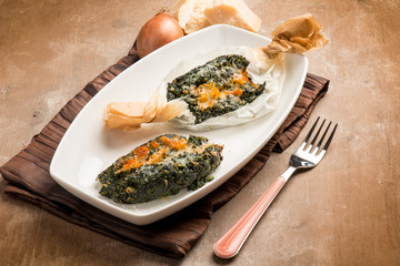 Wall Mural - wrapped spinach with parmesan cheese oven cooked