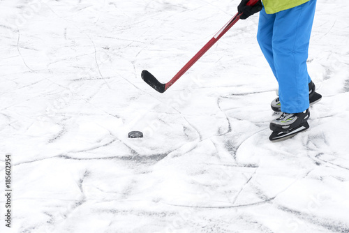 Outdoor Ice Skating Hockey Player S Legs And Skates On Ice Rink