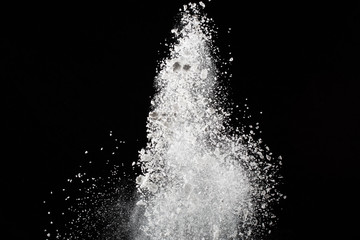 Wall Mural - white powder. grainy abstract texture on black background.