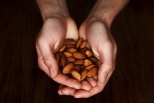 Close-up Of Handful Of Almonds
