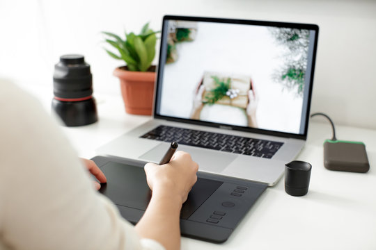retouching on computer laptop