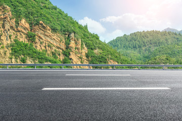 empty asphalt highway in the mountains