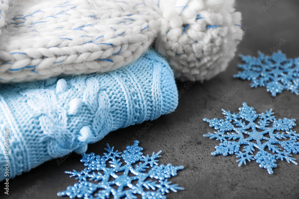 Warm knitted clothes on table. Seasonal female wardrobe
