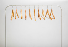 Wardrobe Stand With Hangers On Light Background