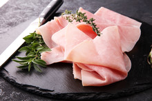 Sliced Ham On Stone Background. Fresh Prosciutto. Pork Ham Sliced.