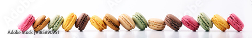 Fotomural Sweet and colourful french macaroons or macaron on white background, Dessert