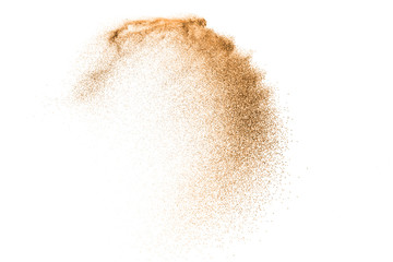 gold sand explosion isolated on white background. abstract sand cloud. gold sand splash agianst on c