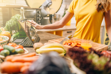 Female person cooking on the kitchen, healthy food