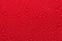 Texture Of Water Drops On A Red Background