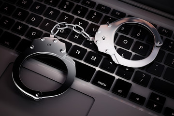 Poster - Cyber Crime Concept. Handcuffs on Laptop Computer. 3d Rendering