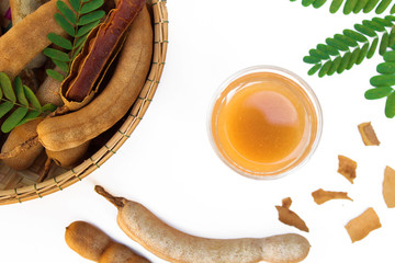 Wall Mural - Tamarind and tamarind juice with honey on white background