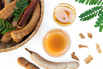 Wall Mural - Tamarind and tamarind juice with honey on white background