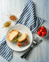 Sticker - Plate with delicious sandwiches on table, top view