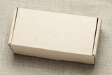 Fototapeta Lawenda - Cardboard box on a wooden background
