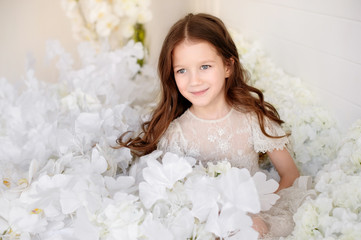 Beautiful girl in a amazing dress with flowers.