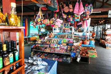 beautiful and colourful silk and cotton indian scarfs, bags and bottles sold in souvenir shop market