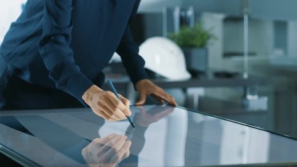 Poster - Talented Young Female Architectural Designer Draws Building Concept on a Graphics Tablet Display Vertical Touchscreen Table. Clean Minimalistic Office. Shot on RED EPIC-W 8K Helium Cinema Camera.