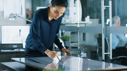 Poster - Talented Young Female Architectural Designer Draws Building Concept on a Graphics Tablet Display. Clean Minimalistic Office. Shot on RED EPIC-W 8K Helium Cinema Camera.
