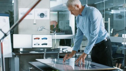 Aufkleber - Experienced Automotive Designer Works With Digital Display Graphics Tablet Touschreen Table, Drawing Sketch of a New Car Prototype.Shot on RED EPIC-W 8K Helium Cinema Camera.