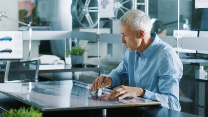 Aufkleber - Experienced Automotive Designer Works With Digital Display Graphics Tablet Touschreen Table, Drawing Sketch of a New Car Prototype. Shot on RED EPIC-W 8K Helium Cinema Camera.
