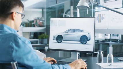 Aufkleber - Automotive Engineer Works on the Personal Computer, He Perfects New Car Model Prototype Sketch. He Works in the Bright and Modern Office. Shot on RED EPIC-W 8K Helium Cinema Camera.