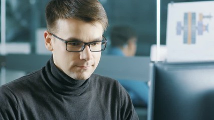 Aufkleber - Young Male Industrial Engineer Works on a Personal Computer. Handsome Smart Man in the Bright Modern Office. Shot on RED EPIC-W 8K Helium Cinema Camera.