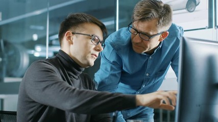 Aufkleber - Experienced Senior Engineer Consults Young Designer about Project, They Have Discussion and Work on a Personal Computer. Shot on RED EPIC-W 8K Helium Cinema Camera.