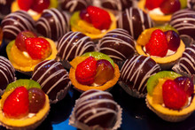 Mini Fruit Tarts In A Row Standby In Buffet For Customer 