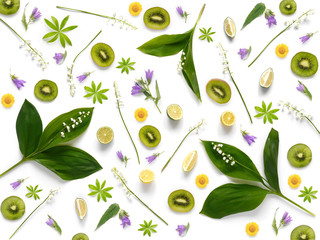Wall Mural - Composition pattern from plants, kiwi, lily of the valley  isolated on white background, flat lay, top view. The concept of summer, spring, Mother's Day, March 8.