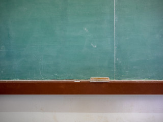 blank classroom chalkboard with eraser and chalk