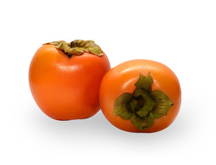 Two fresh persimmons isolated on white background.
