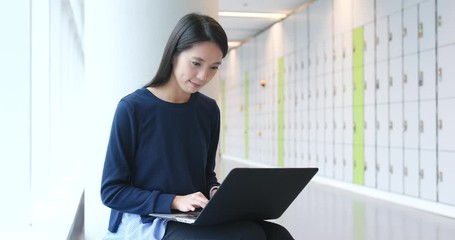 Sticker - Student doing homework on laptop computer