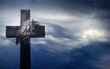 Easter Cross With Crown Of Thorns Against Blue Sky Abstract Background With Empty Space
