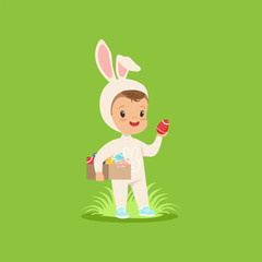 Sticker - Cute little boy in a white bunny costume holding box of painted eggs, kid having fun on Easter egg hunt vector Illustration